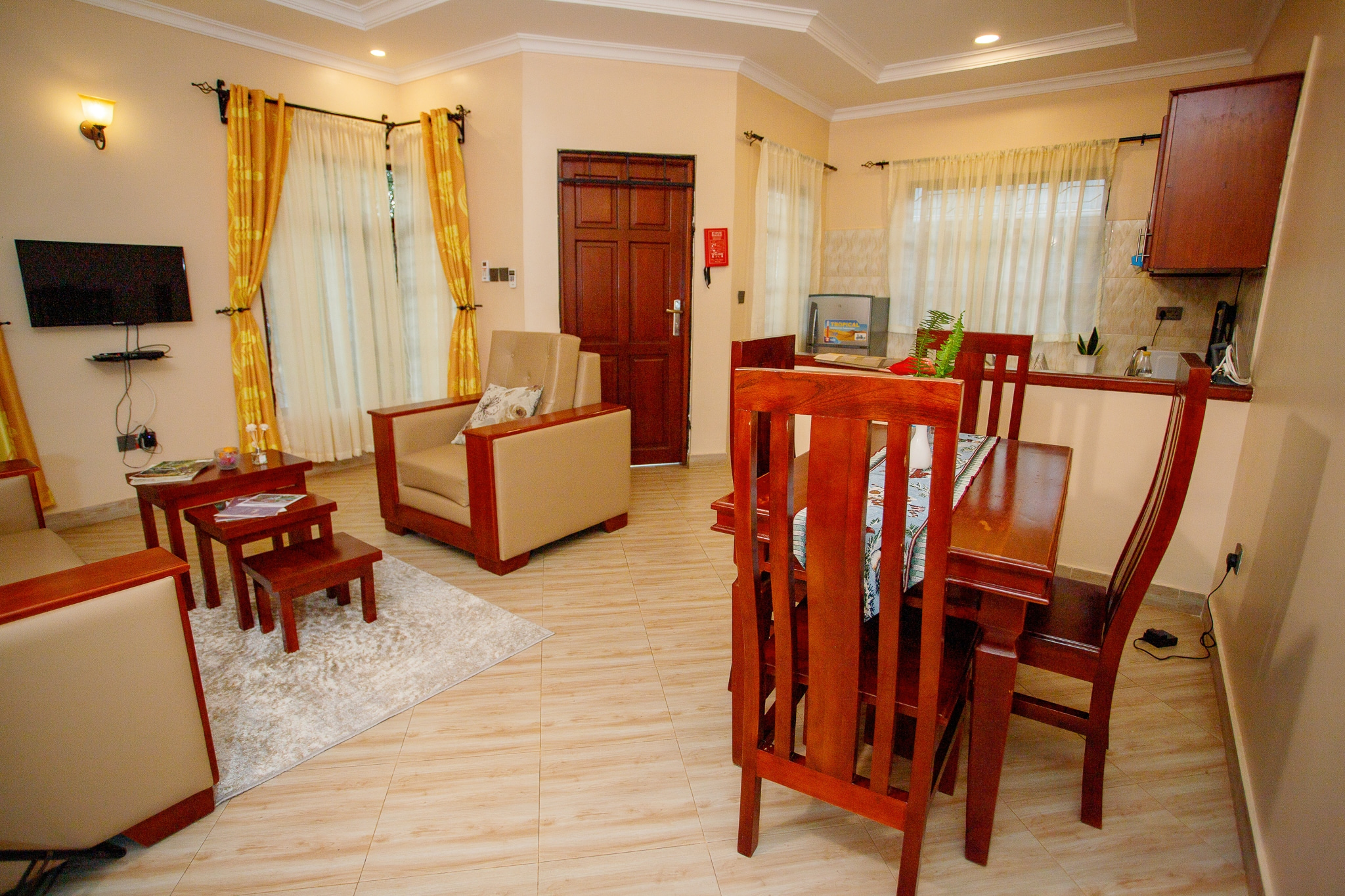 Spacious living and dining area with wooden furniture